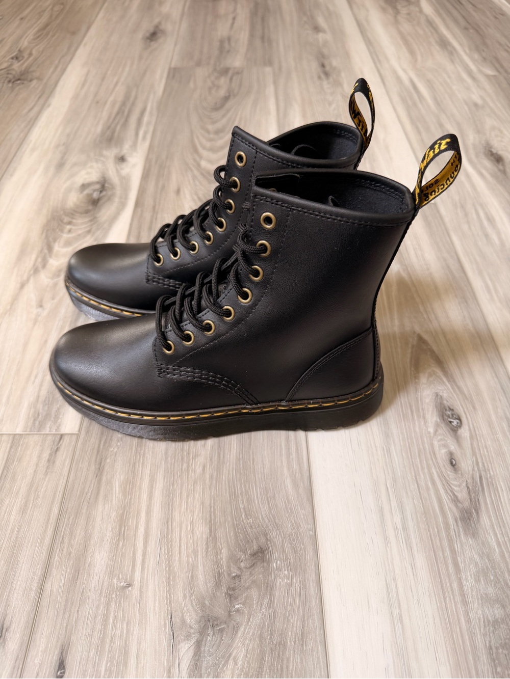 Dr. Martens Black Leather 8-Eye Lace-Up Combat Boots with Yellow Heel Loop